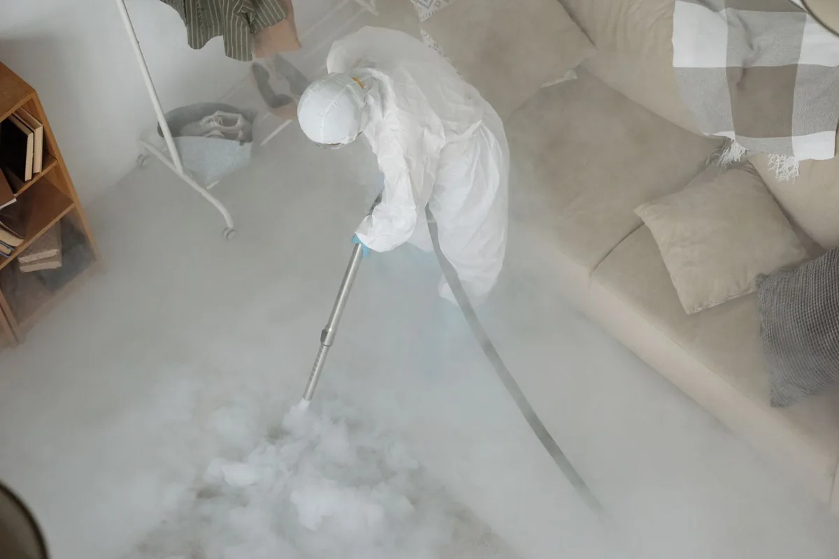 Biohazard cleanup technician in protective equipment, El Paso, TX